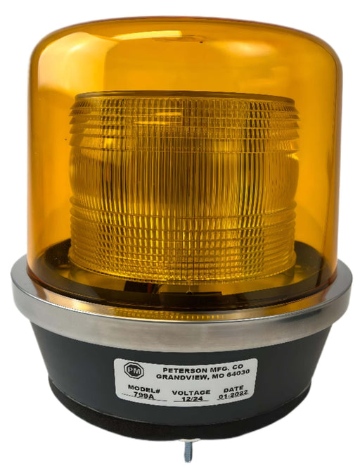 An amber LED beacon light with a black mounting base 