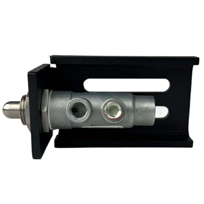A metal hydraulic cylinder stroke limiter valve on a black mounting bracket with 1 plugged ports and 1 open port
