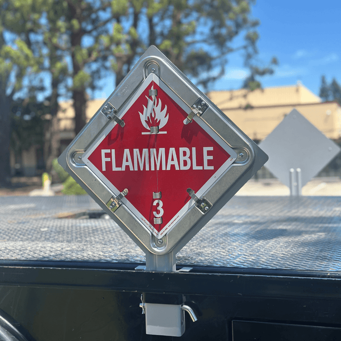A close view of a stake pocket placard holder mounted on a flatbed trailer