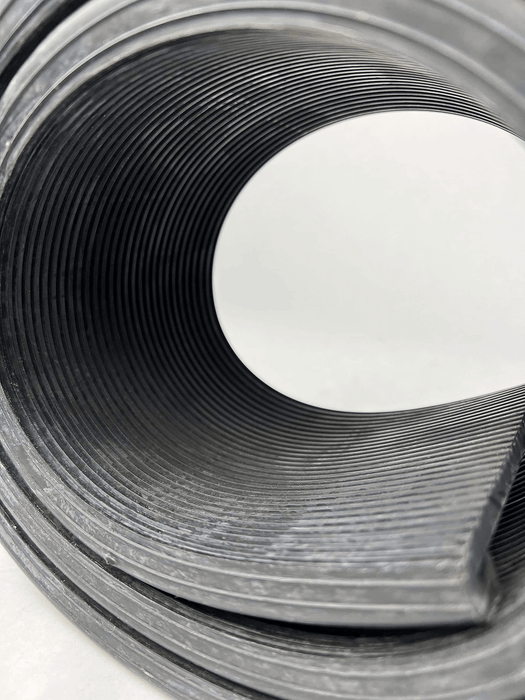 Close view of grooves of a rolled volvo fuel tank strap isolator
